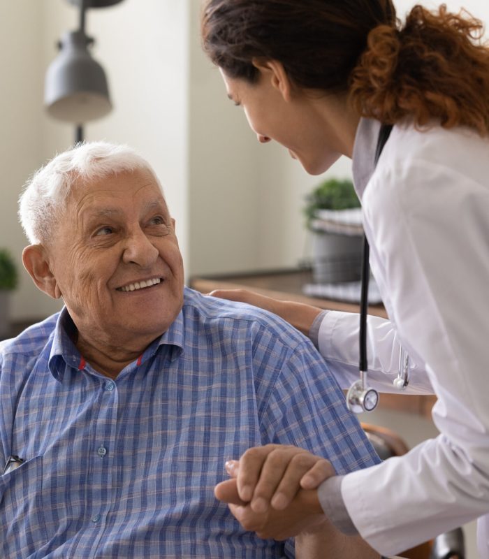 Close,Up,Caring,Nurse,Holding,Smiling,Mature,Patient,Hand,At Close,Up,Caring,Nurse,Holding,Smiling,Mature,Patient,Hand,At